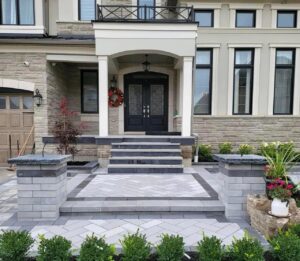 Interlocking front porch with pillars and steps
