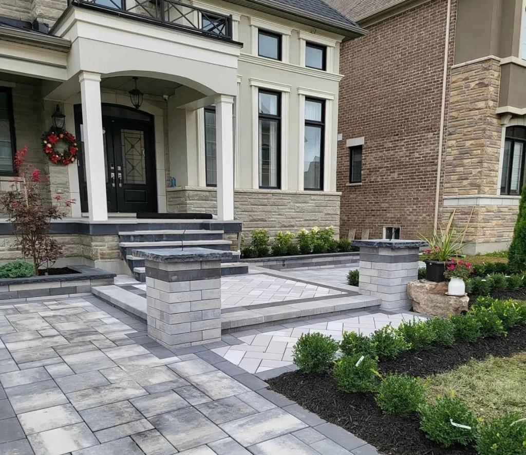 interlocking front porch with pillars and steps